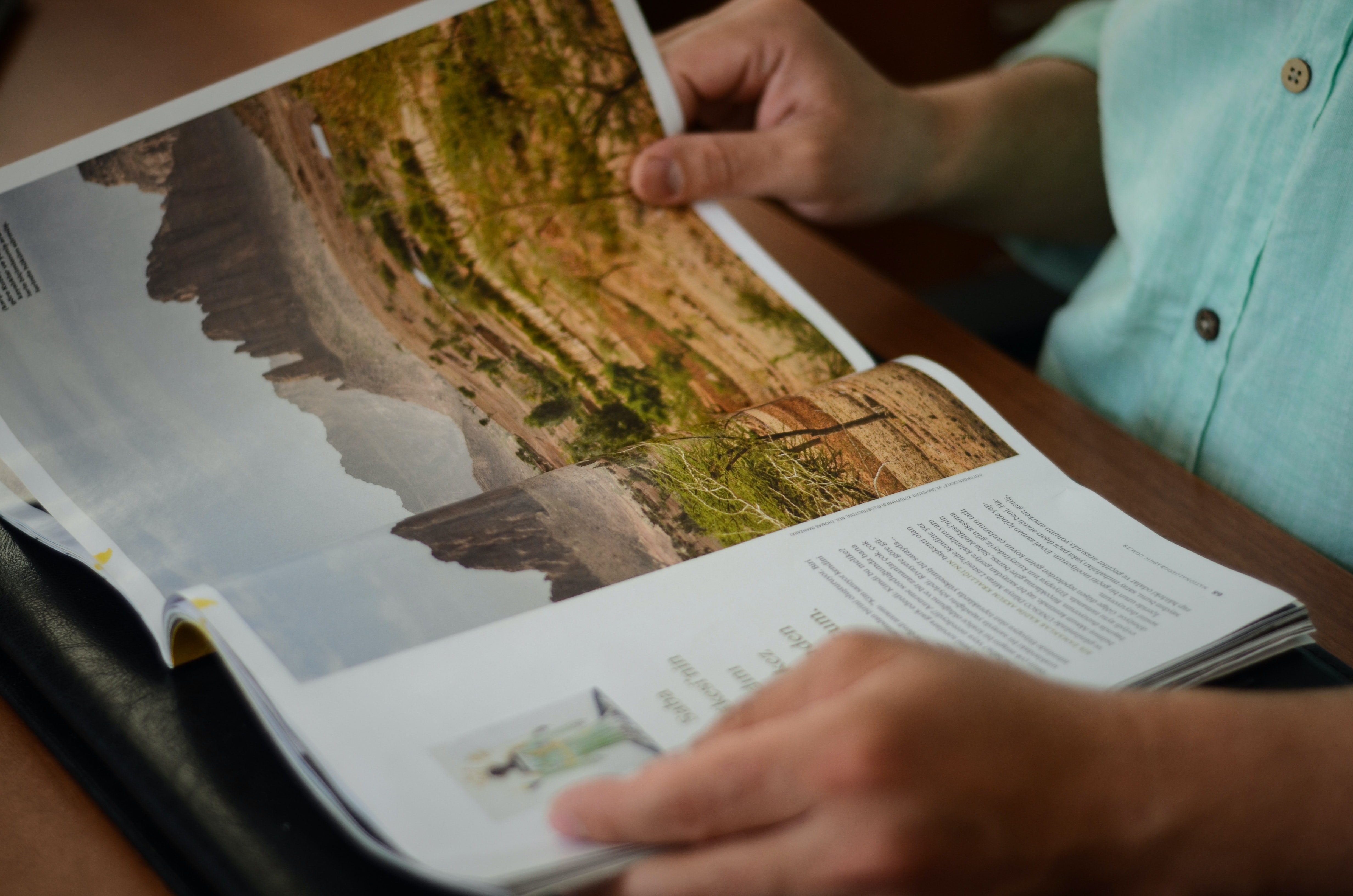 man reading magazine