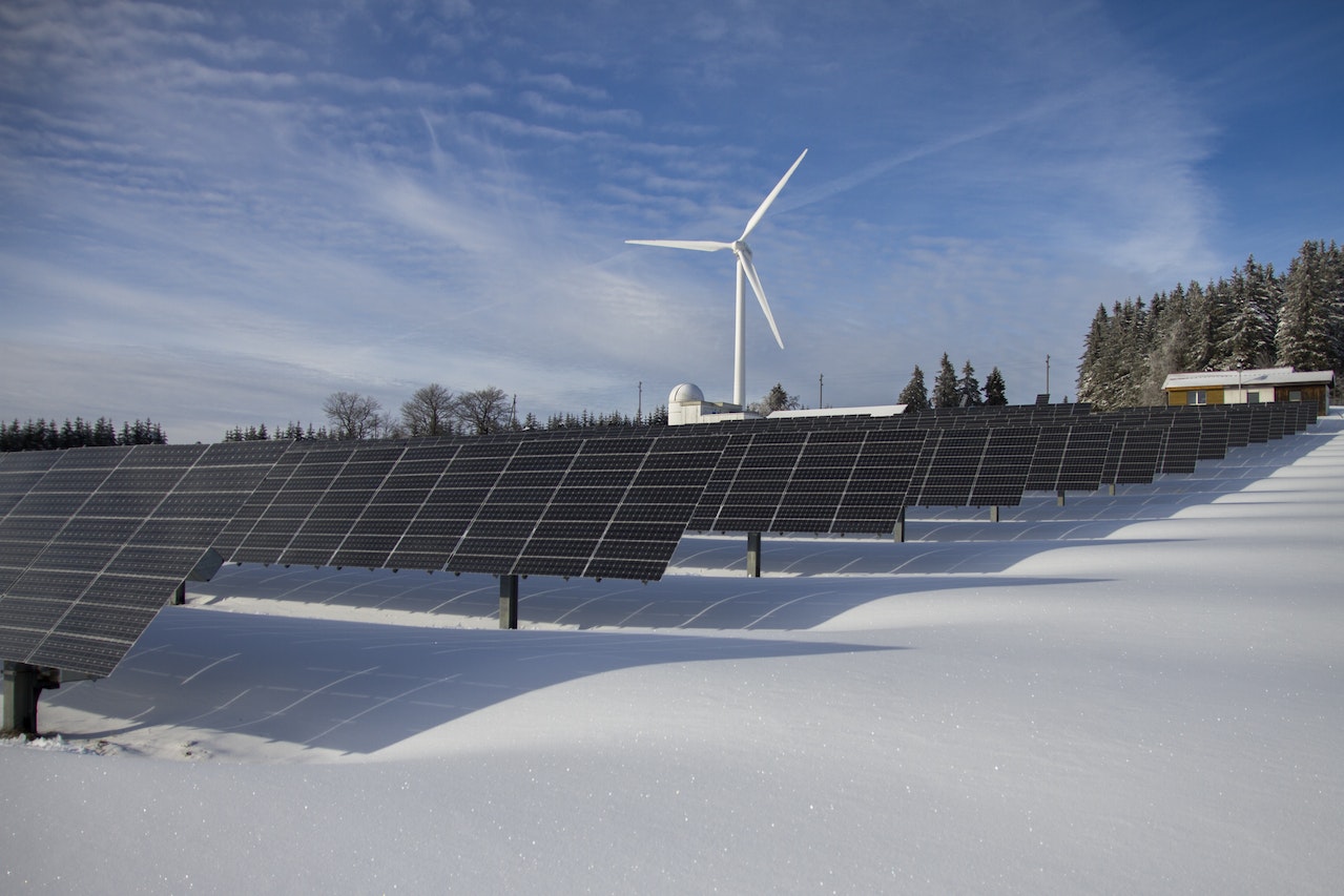 image of solar panel and wind turbine